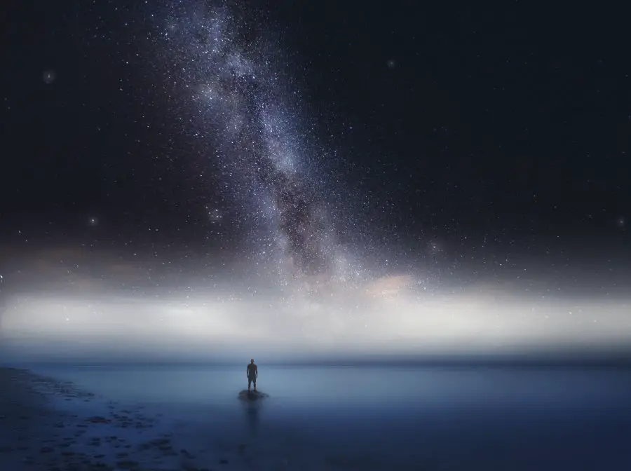 Surreal sea at night landscape with starry sky. Dreamy look.