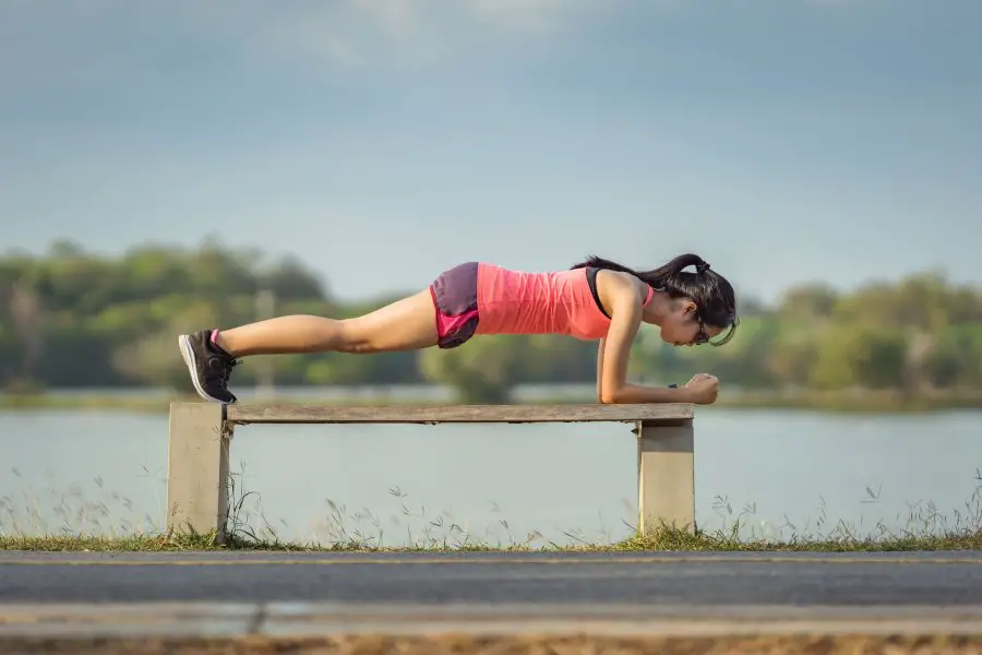 Woman Planking On Bench