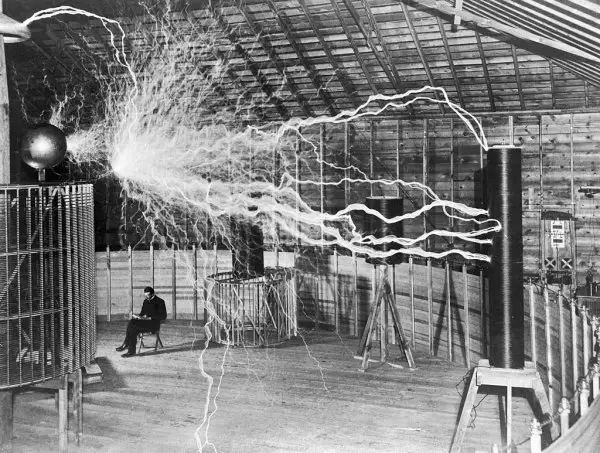 Nikola Tesla with his equipment EDIT