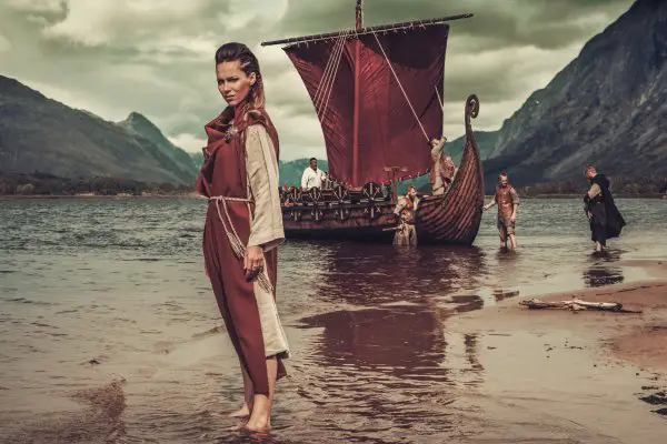 viking woman standing near drakkar on seashore 2021 08 26 16 21 13 utc